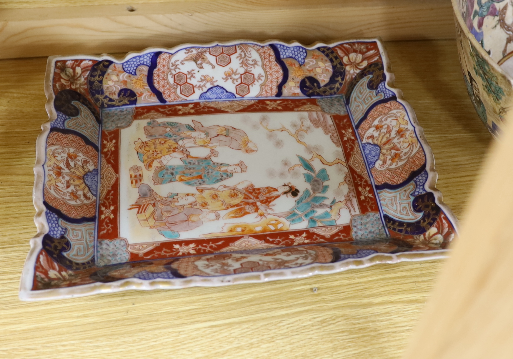 An 18th century Chinese export ware meat plate painted with a courtyard scene with figures (a.f.), a large Chinese porcelain crackle glaze warrior bowl (a.f.), together with a rectangular Japanese Imari palette export di